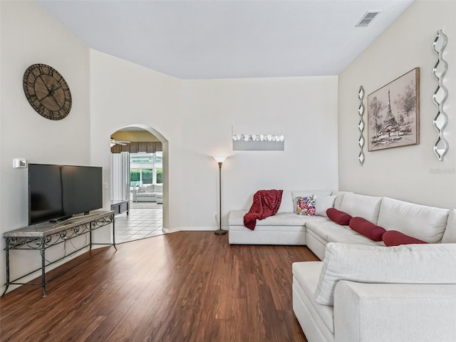 17787 SE 114th Ave, Summerfield, FL 34491 - living area featuring baseboards, wood finished floors, visible vents, and arched walkways