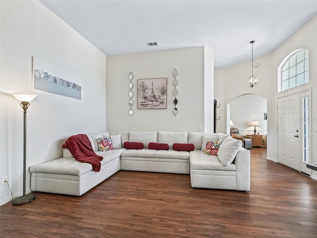17787 SE 114th Ave, Summerfield, FL 34491 - living room featuring visible vents, baseboards, wood finished floors, and arched walkways