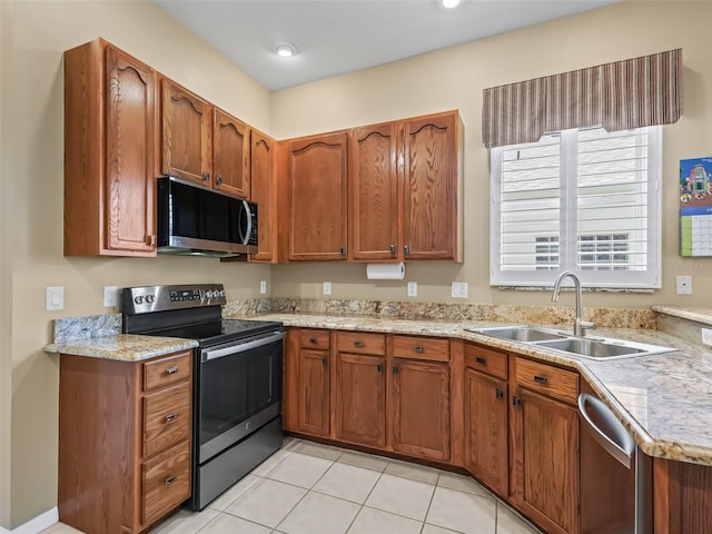 17787 SE 114th Ave, Summerfield, FL 34491 - kitchen with stainless steel appliances, a sink, and brown cabinets