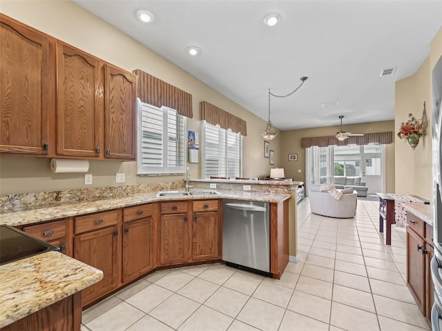 17787 SE 114th Ave, Summerfield, FL 34491 - kitchen with a sink, brown cabinets, dishwasher, a peninsula, and visible vents