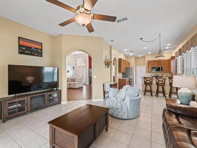 17787 SE 114th Ave, Summerfield, FL 34491 - living room with ceiling fan, visible vents, arched walkways, and light tile patterned floors