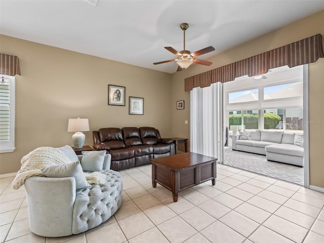 17787 SE 114th Ave, Summerfield, FL 34491 - living room featuring ceiling fan, baseboards, light tile patterned flooring, and visible vents