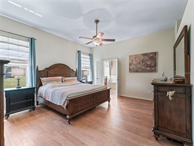 17787 SE 114th Ave, Summerfield, FL 34491 - bedroom with ceiling fan, baseboards, and light wood-style floors