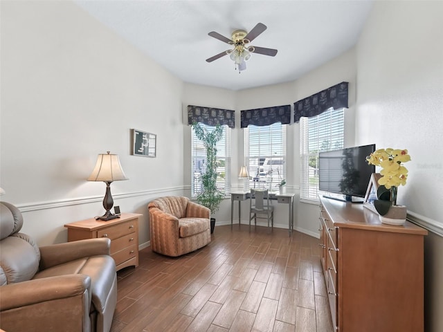17787 SE 114th Ave, Summerfield, FL 34491 - living area featuring baseboards, a ceiling fan, and wood finished floors