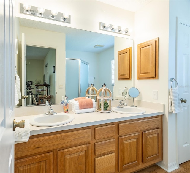 bathroom with double vanity and a sink