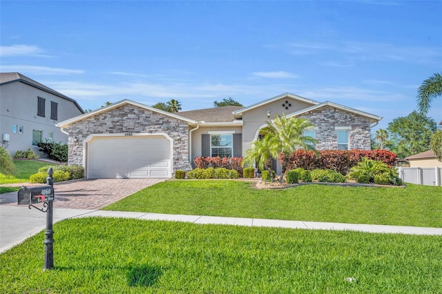 ranch-style house with a front lawn, driveway, stone siding, and a garage
