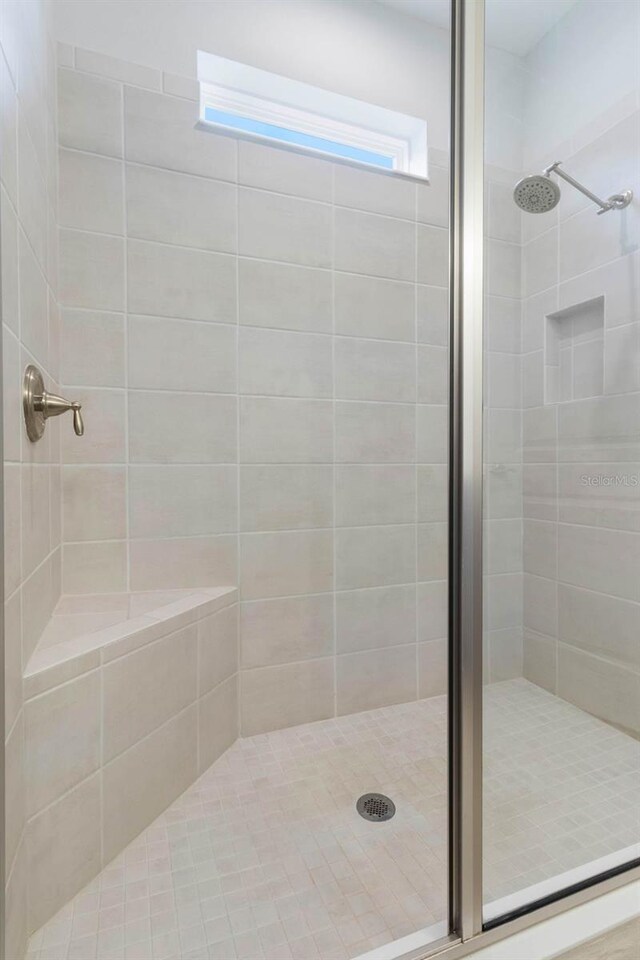 2129 Palm Tree Dr, Poinciana, FL 34759 - bathroom featuring a stall shower