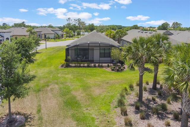 2129 Palm Tree Dr, Poinciana, FL 34759 - rear view of property with a yard and a residential view