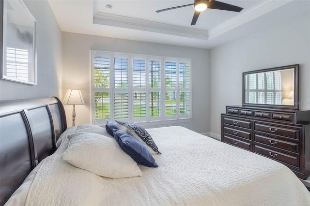 2129 Palm Tree Dr, Poinciana, FL 34759 - bedroom featuring a raised ceiling, crown molding, baseboards, and ceiling fan