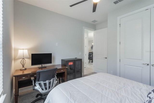 2129 Palm Tree Dr, Poinciana, FL 34759 - carpeted bedroom with visible vents and ceiling fan