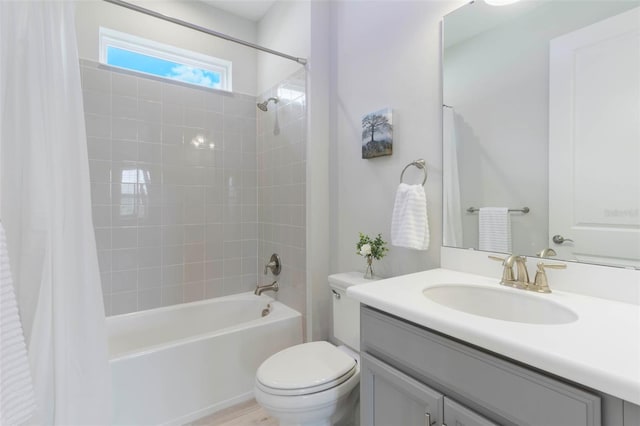 2129 Palm Tree Dr, Poinciana, FL 34759 - bathroom featuring toilet, vanity, and shower / bathtub combination with curtain