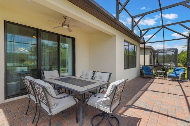 2129 Palm Tree Dr, Poinciana, FL 34759 - view of patio / terrace with outdoor dining space, a lanai, and ceiling fan