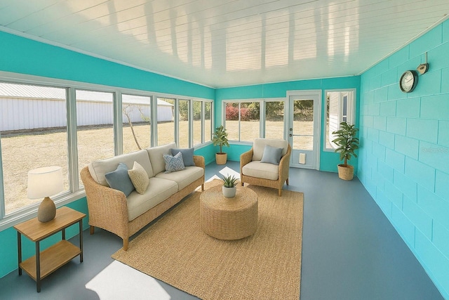 sunroom featuring an outdoor living space and a healthy amount of sunlight