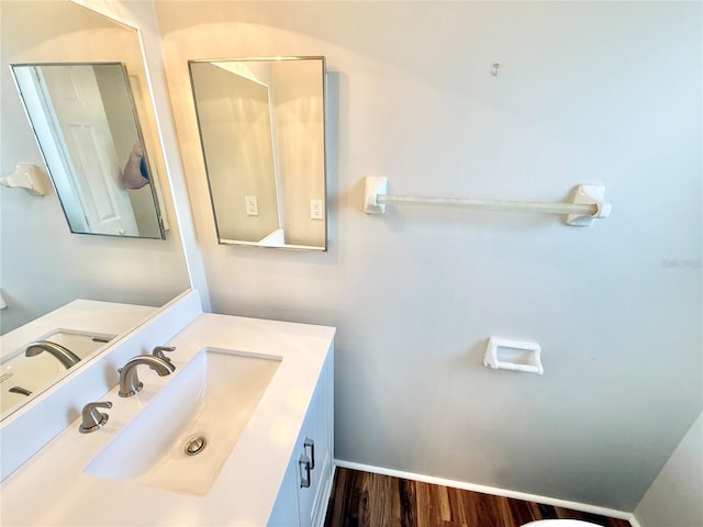 bathroom featuring vanity and wood finished floors