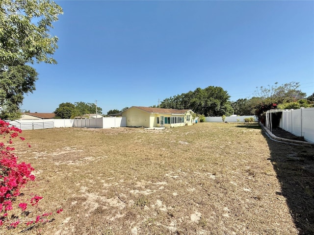 view of yard with a fenced backyard