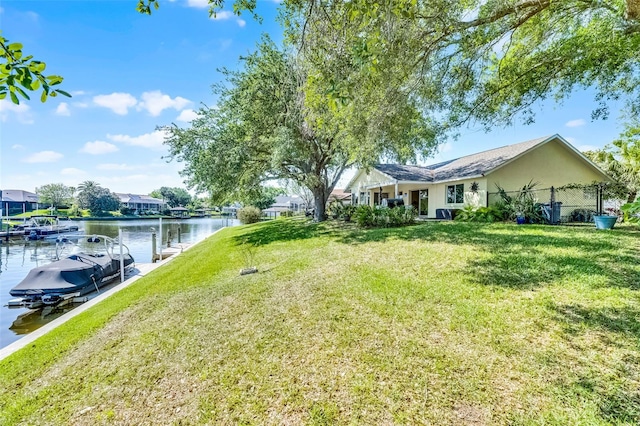 14 Clear Ct, Palm Coast, FL 32137 - view of yard featuring fence, a boat dock, and a water view