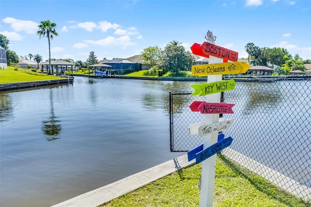 14 Clear Ct, Palm Coast, FL 32137 - view of dock featuring a water view, a residential view, and fence