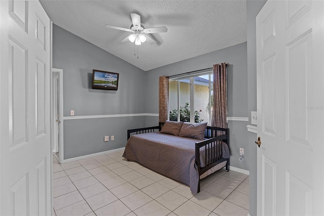 14 Clear Ct, Palm Coast, FL 32137 - bedroom featuring light tile patterned floors, a textured ceiling, vaulted ceiling, and a ceiling fan