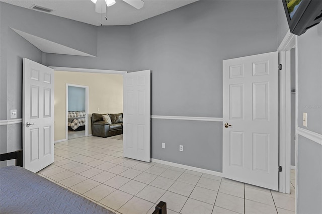 14 Clear Ct, Palm Coast, FL 32137 - bedroom with light tile patterned floors, visible vents, baseboards, and a ceiling fan