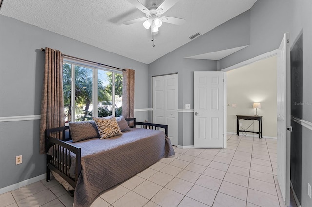 14 Clear Ct, Palm Coast, FL 32137 - bedroom featuring visible vents, light tile patterned floors, a ceiling fan, a textured ceiling, and vaulted ceiling