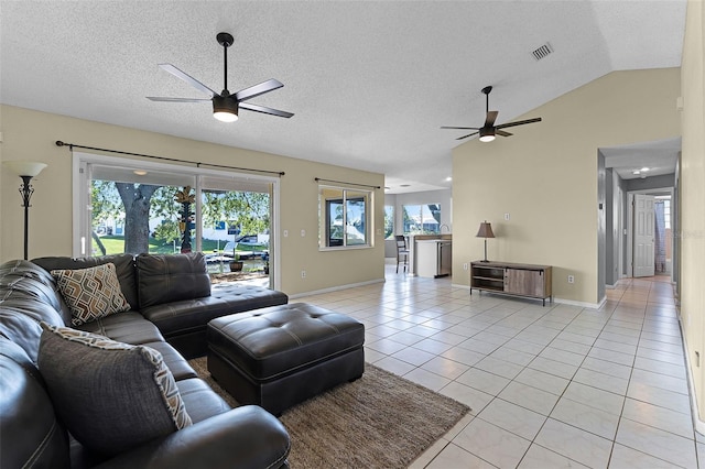 14 Clear Ct, Palm Coast, FL 32137 - living area with visible vents, light tile patterned floors, ceiling fan, a wealth of natural light, and lofted ceiling