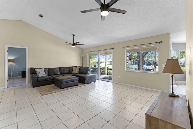 14 Clear Ct, Palm Coast, FL 32137 - living room featuring a textured ceiling, ceiling fan, lofted ceiling, and light tile patterned floors