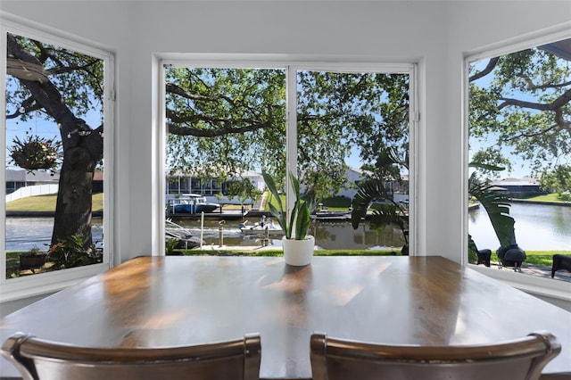 14 Clear Ct, Palm Coast, FL 32137 - dining space featuring a water view and a wealth of natural light