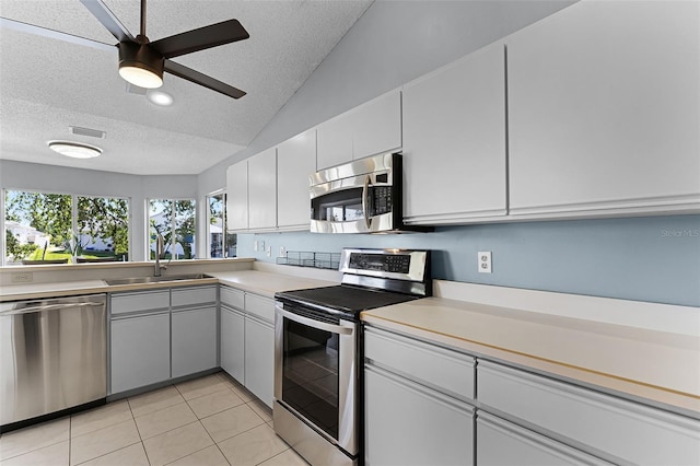 14 Clear Ct, Palm Coast, FL 32137 - kitchen with a textured ceiling, appliances with stainless steel finishes, a sink, and visible vents