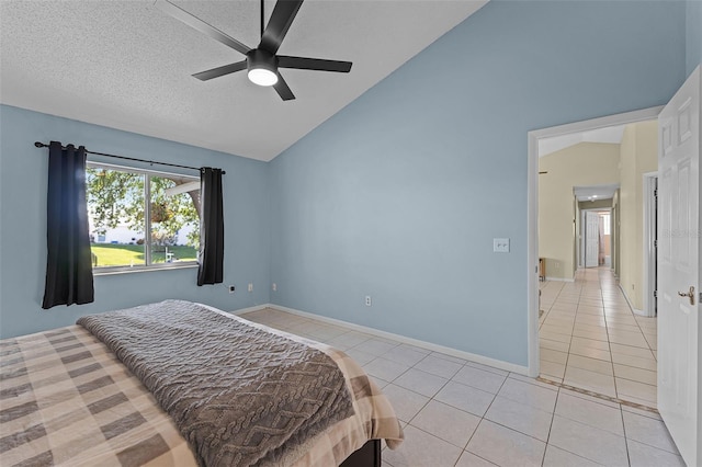 14 Clear Ct, Palm Coast, FL 32137 - bedroom featuring high vaulted ceiling, light tile patterned floors, a textured ceiling, a ceiling fan, and baseboards