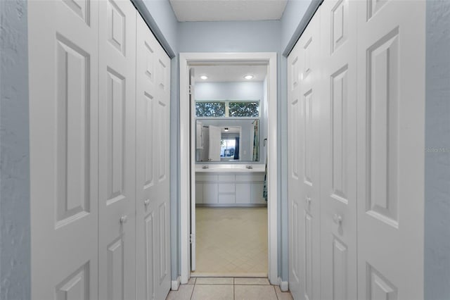 14 Clear Ct, Palm Coast, FL 32137 - hallway featuring light tile patterned floors and a textured ceiling