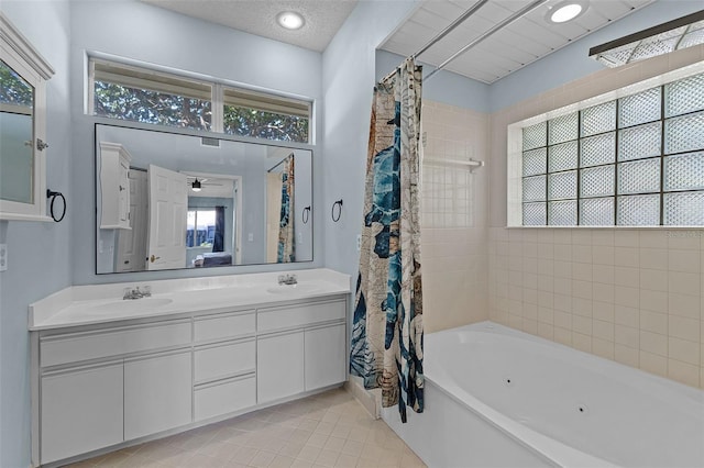 14 Clear Ct, Palm Coast, FL 32137 - full bathroom featuring a sink, double vanity, plenty of natural light, and tile patterned flooring