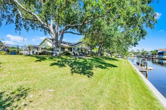 14 Clear Ct, Palm Coast, FL 32137 - view of yard with fence, a boat dock, and a water view