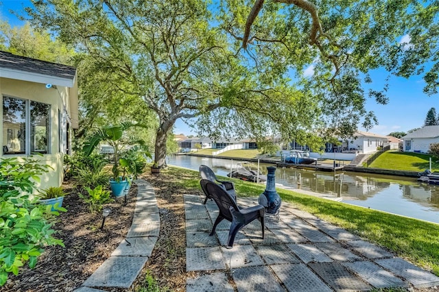 14 Clear Ct, Palm Coast, FL 32137 - view of patio with a water view and a residential view