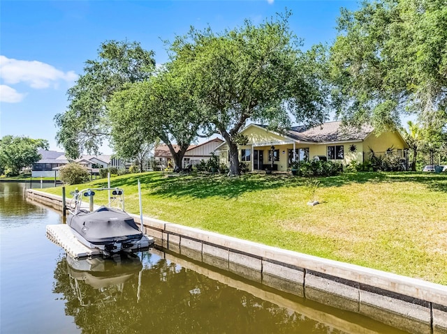14 Clear Ct, Palm Coast, FL 32137 - view of dock with a water view and a yard