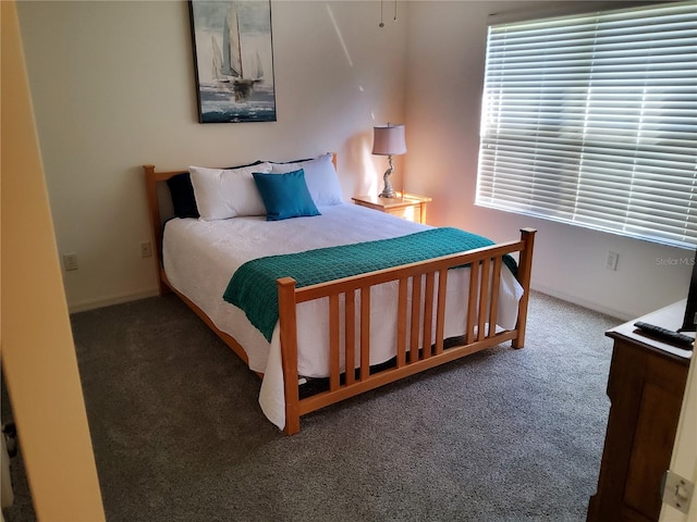 carpeted bedroom with baseboards