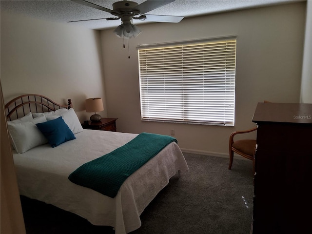 carpeted bedroom featuring a textured ceiling, ceiling fan, and baseboards
