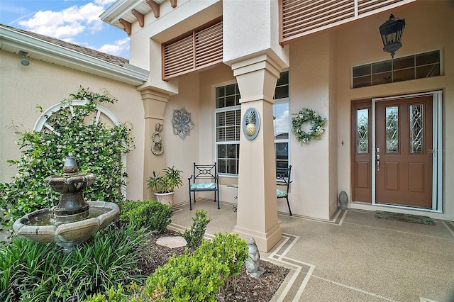 doorway to property with stucco siding