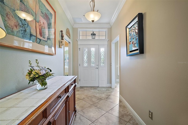 entryway featuring baseboards, ornamental molding, visible vents, and light tile patterned floors