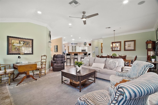 living area with recessed lighting, visible vents, crown molding, and ceiling fan with notable chandelier