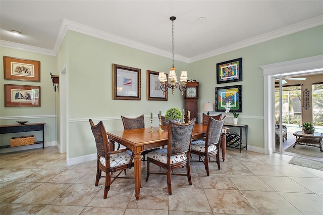 dining space with crown molding, baseboards, and an inviting chandelier