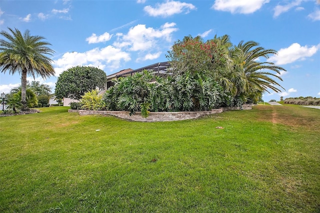view of yard featuring a lanai