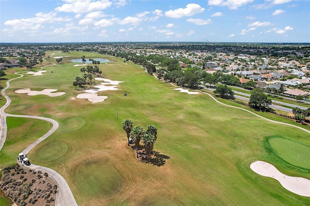 bird's eye view with a residential view, golf course view, and a water view
