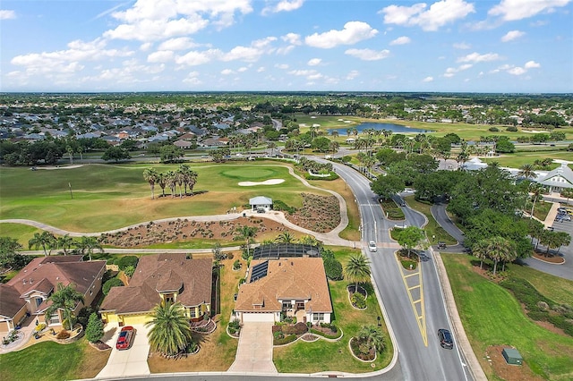 bird's eye view featuring view of golf course, a water view, and a residential view