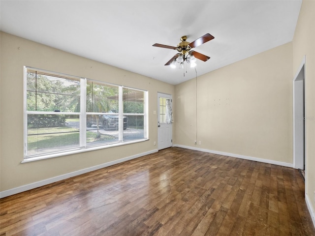 25519 Colmar Ave, Sorrento, FL 32776 - unfurnished room featuring wood finished floors, a ceiling fan, and baseboards
