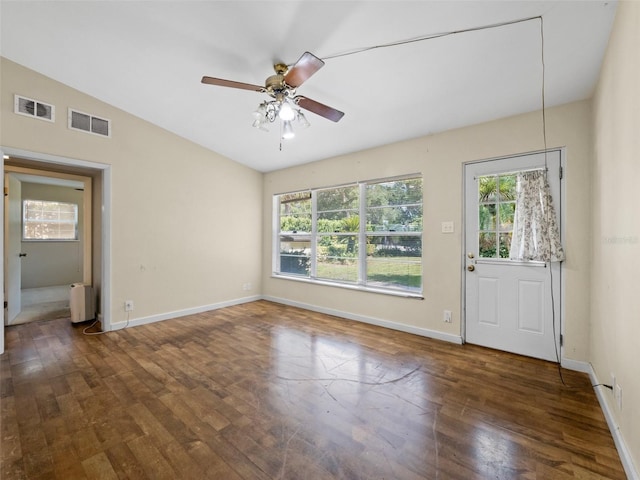 25519 Colmar Ave, Sorrento, FL 32776 - empty room featuring healthy amount of natural light, hardwood / wood-style flooring, baseboards, and lofted ceiling