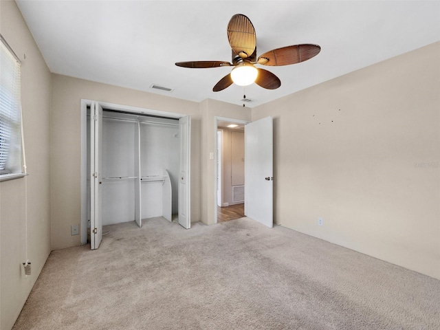 25519 Colmar Ave, Sorrento, FL 32776 - unfurnished bedroom featuring carpet, a closet, and ceiling fan