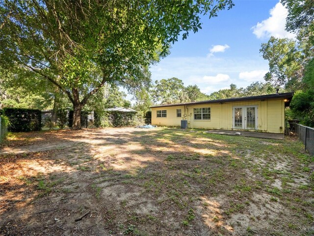25519 Colmar Ave, Sorrento, FL 32776 - back of property with french doors and a fenced backyard