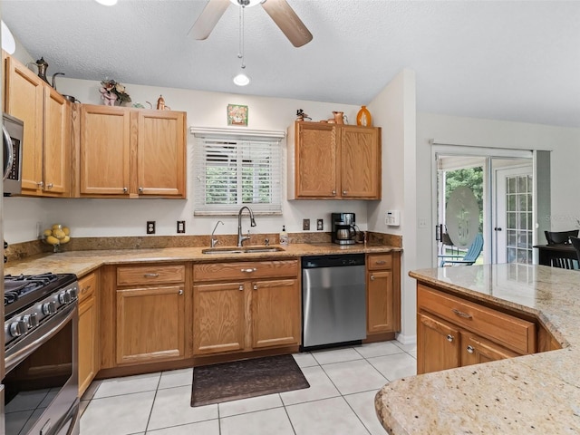 9621 SE 168th Maplesong Ln, The Villages, FL 32162 - kitchen with a sink, appliances with stainless steel finishes, light tile patterned floors, and a healthy amount of sunlight