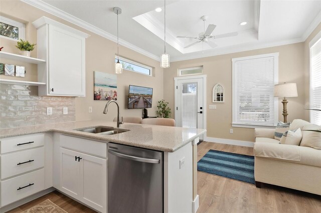 12129 Grand Oak Ln, Oxford, FL 34484 - kitchen featuring stainless steel dishwasher, open shelves, a sink, open floor plan, and a peninsula