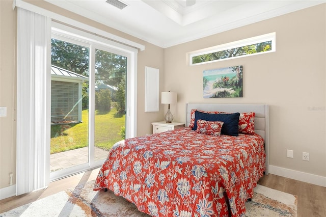 12129 Grand Oak Ln, Oxford, FL 34484 - bedroom featuring light wood finished floors, visible vents, access to outside, and multiple windows